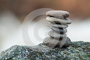 Stone balance on rock in border river