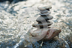 stone balance on rock in the river