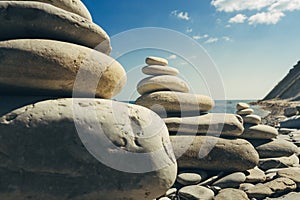 Closeup Stone Zen Pyramids At Beach On Sea Background. Concept Of Harmony And Balance