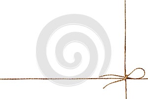 Closeup string or twine tied in a bow isolated on white photo