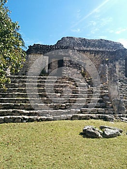 Closeup of structure on steps in Kohunlich Mayan ruins