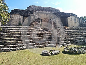 Closeup of structure on steps in Kohunlich Mayan ruins