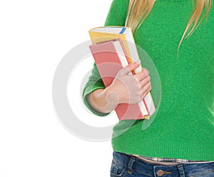 Closeup on student girl with books