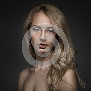 Closeup studio portrait of beauty blond woman