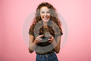 Closeup studio portrait of pretty gamer girl with gamepad