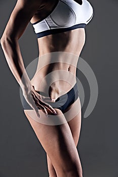 Closeup studio shot fitness woman abs