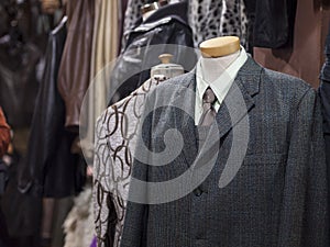 Closeup of stylish suits for men on mannequins in a shop