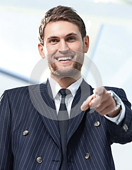 Closeup.successful businessman pointing his finger forward.