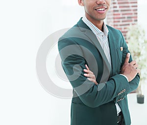 Closeup.successful young businessman standing in office. business people