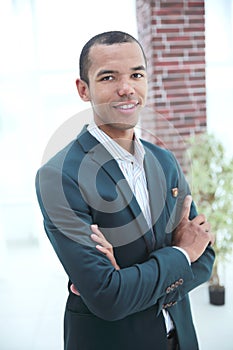 Closeup.successful young businessman standing in office. business people