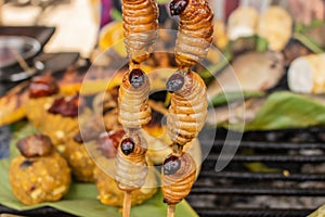 Closeup of Suri insects dish, traditional Peruvian food