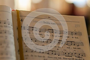 Closeup of the Swedish psalm "silent night" notes on music sheet