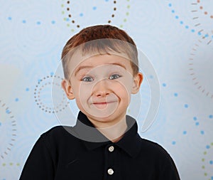 Closeup of sweet little boy making a cute smile