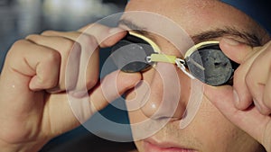 Closeup of swimmer`s face with glasses