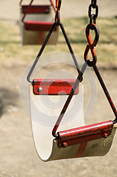 Closeup of swing in a children play area at park