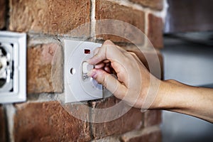 Closeup of switch on brick wall