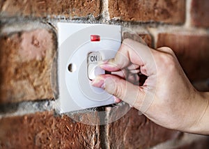 Closeup of switch on brick wall