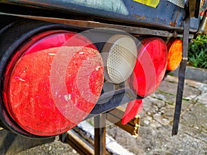 Closeup of tail lights of a truck.