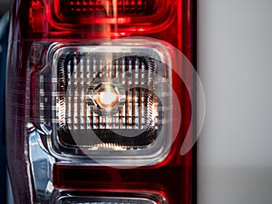 Closeup of a taillight on a truck, turn signal open