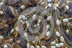 Closeup of a tangled nyl fishing net with white floats