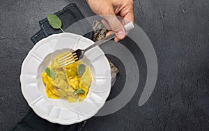 Closeup of tasty appetizing ravioli white plate