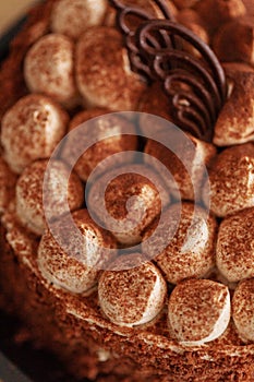 Closeup of tasty chocolate birthday cake, vertical view