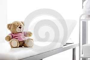 Closeup of teddybear on bed at hospital