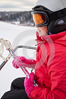 Closeup teenage girl equipped for skiing moves on