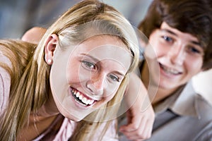 Closeup of teenage girl smiling with brother