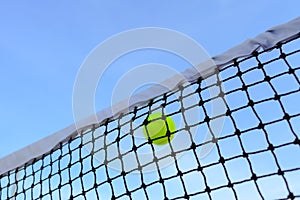 Closeup tennis net and ball