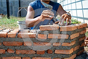 Closeup texture and background of orange bricklayers installed by worker at the construction site