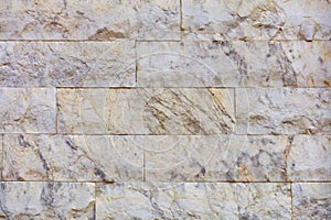 Closeup texture of marble tiles on the facade of the wall