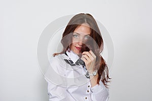 Closeup of a thoughtful red-haired woman isolated