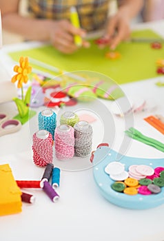 Closeup on threads and buttons on table