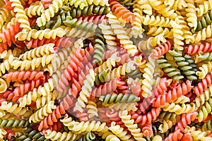 Closeup of three color fusilli variety pasta in beautiful colorful texture