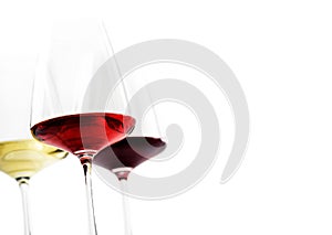 Closeup of three glass of red, rose and white wine isolated over white background. Wine list menu design with copyspace.