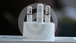 Closeup of three pin plug