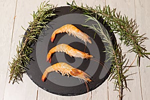 Closeup of three prawns on a plate