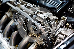 closeup of a timing belt inside the engine area