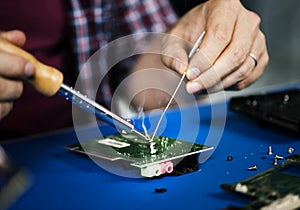 Closeup of tin soldering with electronics circuit board