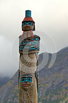 Closeup of Tlingit totem on the Chilkoot River, near Haines, Alaska photo