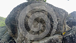 Closeup to an ancient petroglyph of human face at Colombian San Agustin archaeological park.