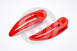 Closeup to Red Plastic Hair Clip, Isolated