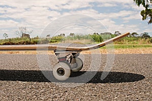 Closeup to skateboard of asphalt