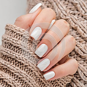 Closeup to woman hands with elegant neutral colors manicure. Beautiful natural looking white nail polish , generated by