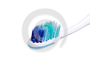 Closeup of toothbrush with soft and slim tapered uneven bristle