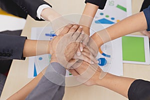 Closeup topview businesspeople join hand together.Stack of people hands. Unity and Team Teamwork Empower business worker for