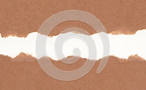Closeup torn brown paper on grunge white paper texture background. Rip Paper note ,brown paper sheet .with space for text ,pattern