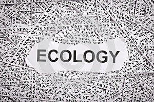 Closeup torn pieces and tapes of paper with the word ECOLOGY.