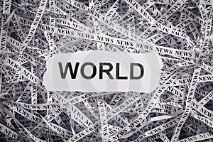 Closeup torn pieces and tapes of paper with the word WORLD.